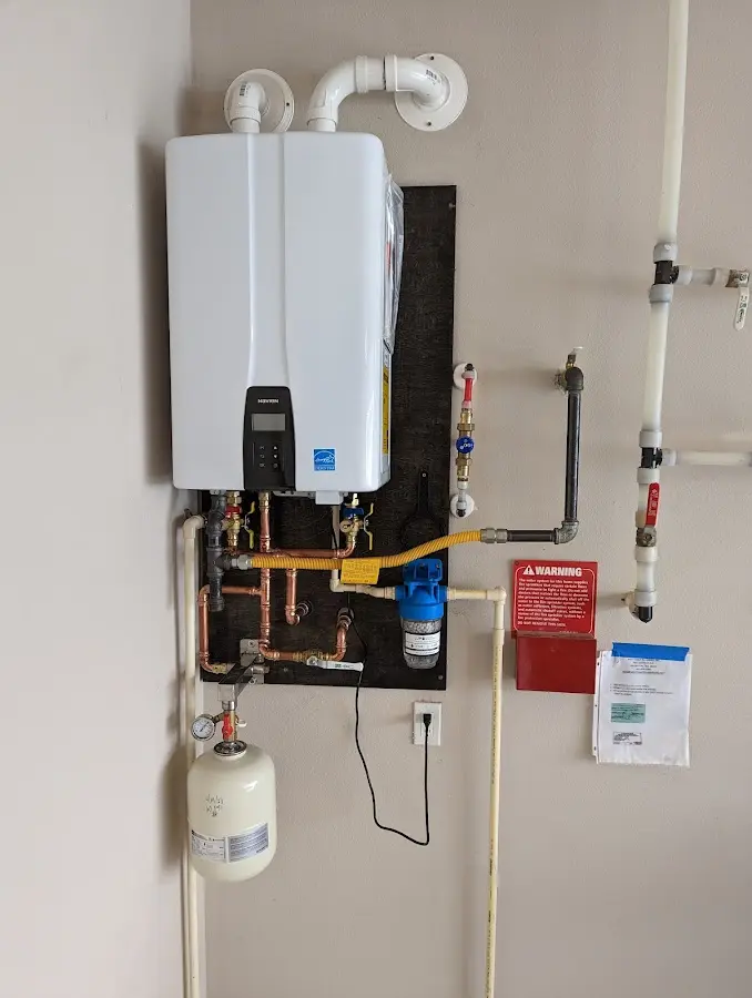 Professional plumber installing copper piping in a Chattahoochee home